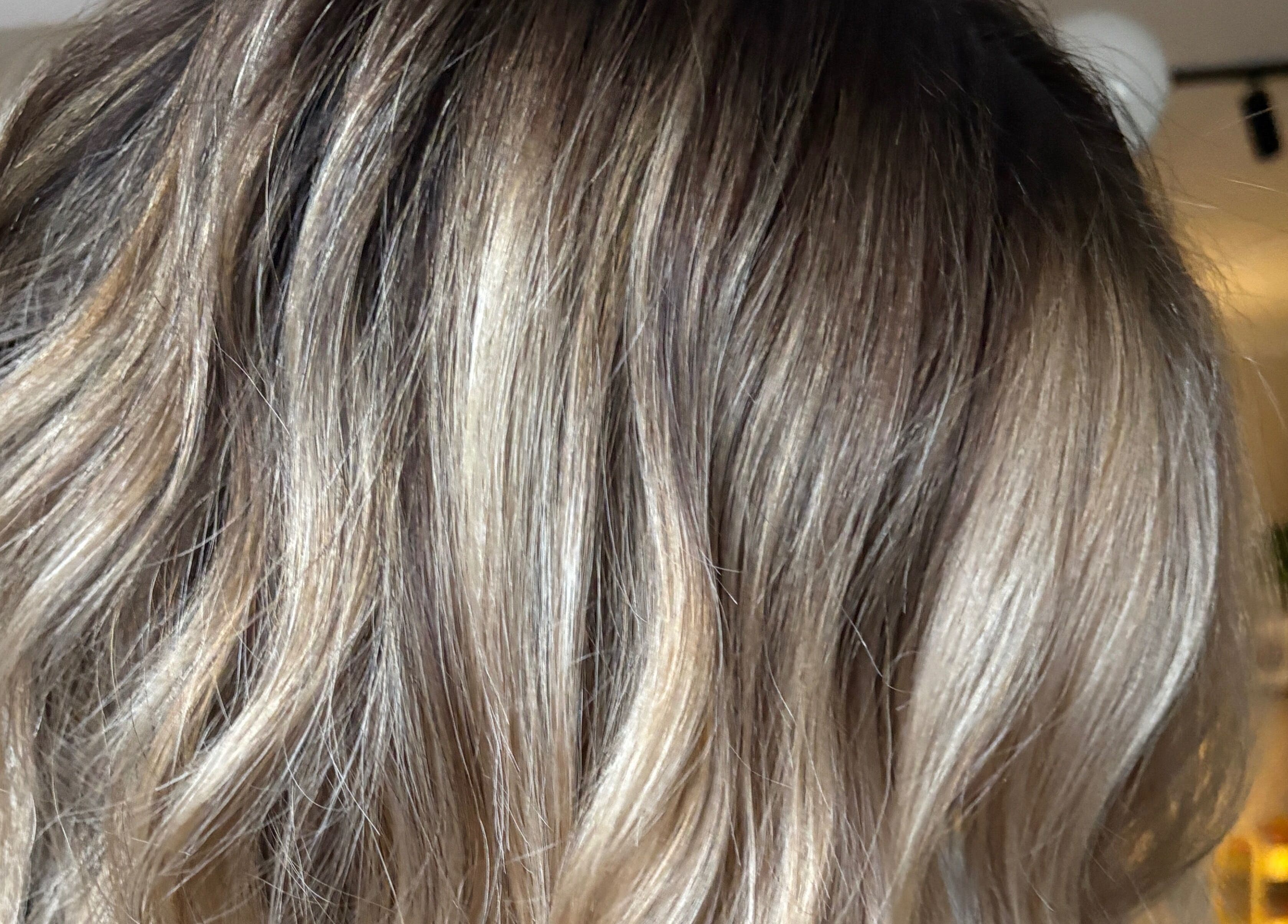 Blonde hair styling at THE Hairdressers in Lowestoft, England, GB, showcasing rich color and shine.