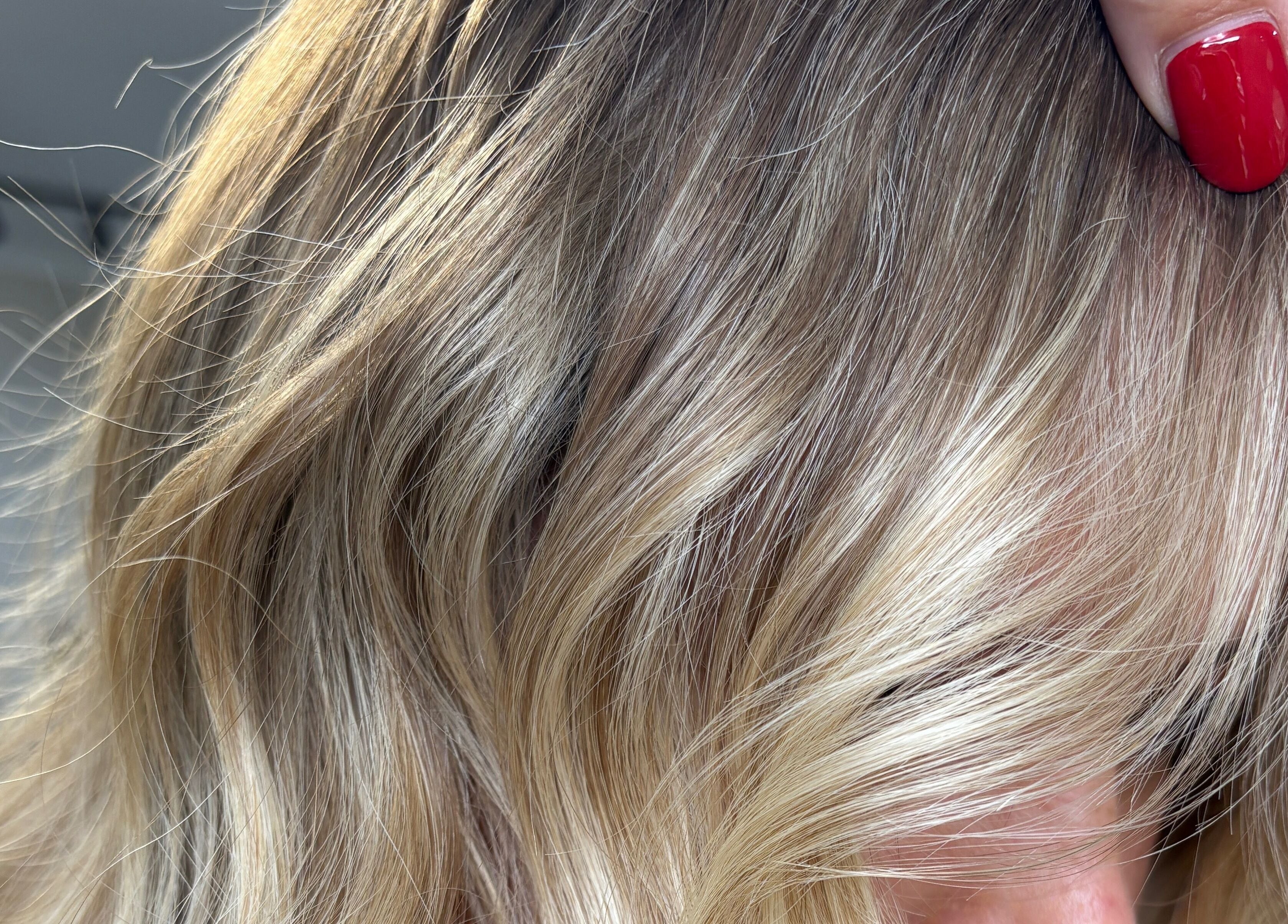 Close-up of highlighted blonde hair at THE Hairdressers, Lowestoft, England, GB.