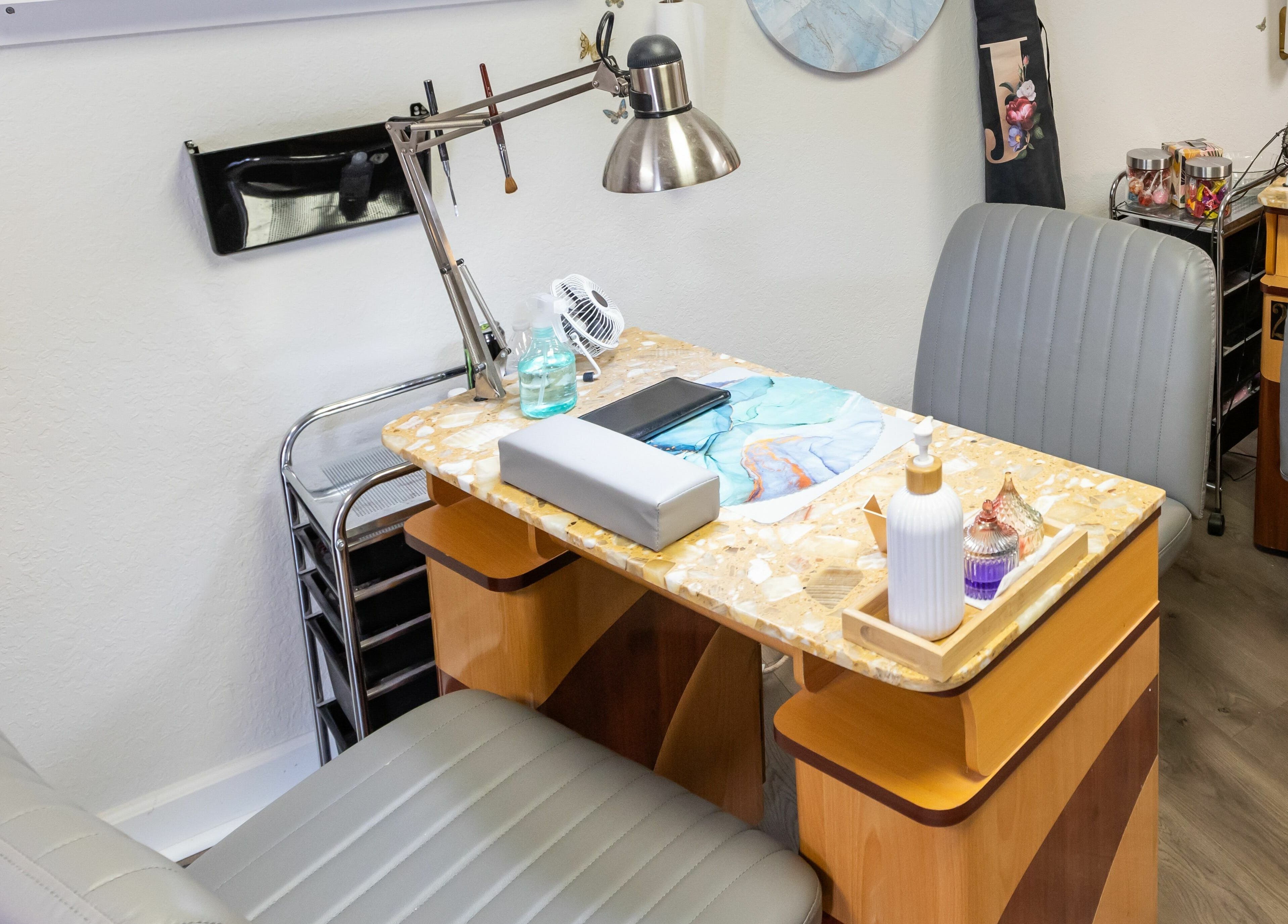 Manicure station at Goddess Nails and Spa.LLC, West Allis, Wisconsin, US: cozy seating and tools ready.