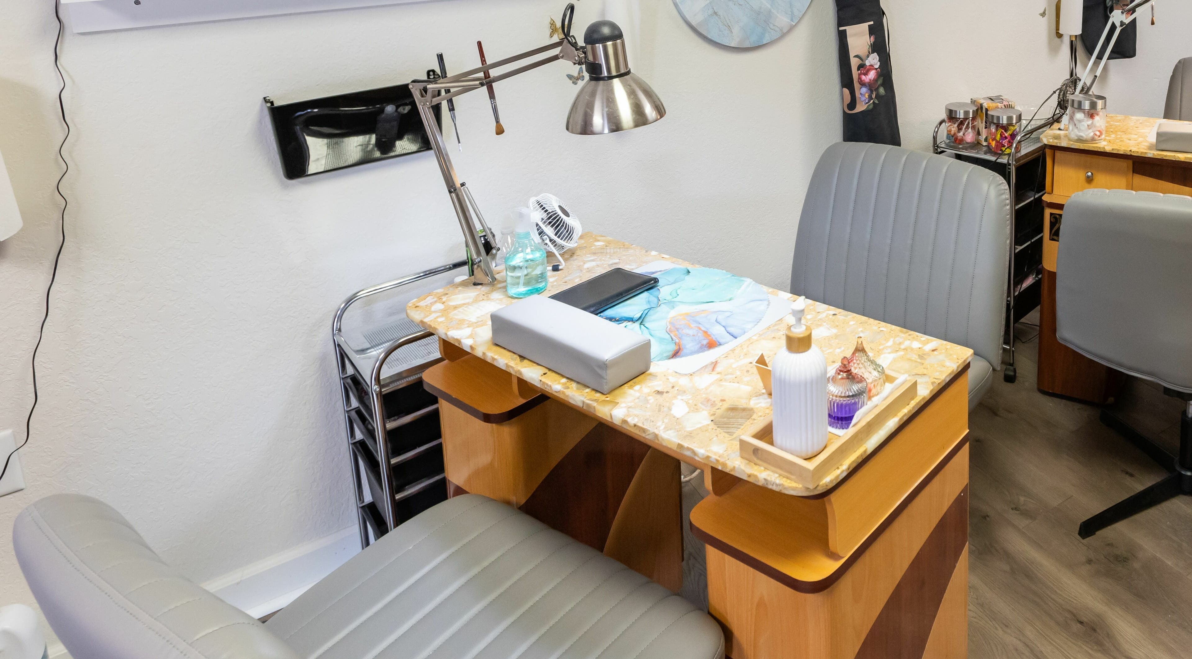 Manicure station at Goddess Nails and Spa.LLC, West Allis, Wisconsin, US: cozy seating and tools ready.