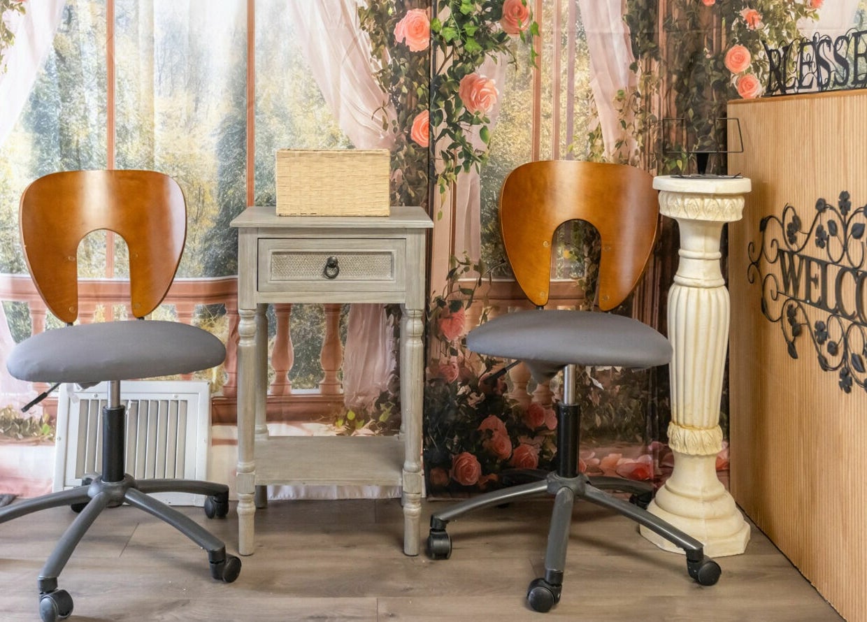 Cozy seating area at Goddess Nails and Spa.LLC, West Allis, Wisconsin, US, with floral wall decor.