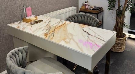 Elegant marble-topped nail station at Edgars Hair Salon, West Bromwich, England, GB.