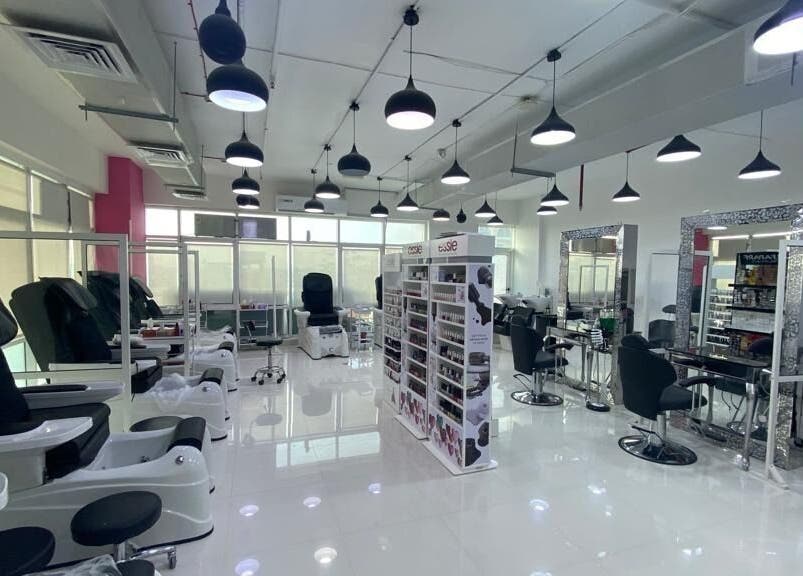 Interior of Eternal Lotus Ladies Salon And Spa in دبي, دبي, AE, featuring modern styling chairs and nail stations.