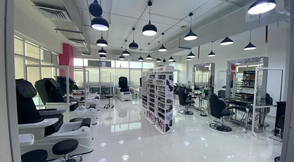 Interior of Eternal Lotus Ladies Salon And Spa in دبي, دبي, AE, featuring modern styling chairs and nail stations.
