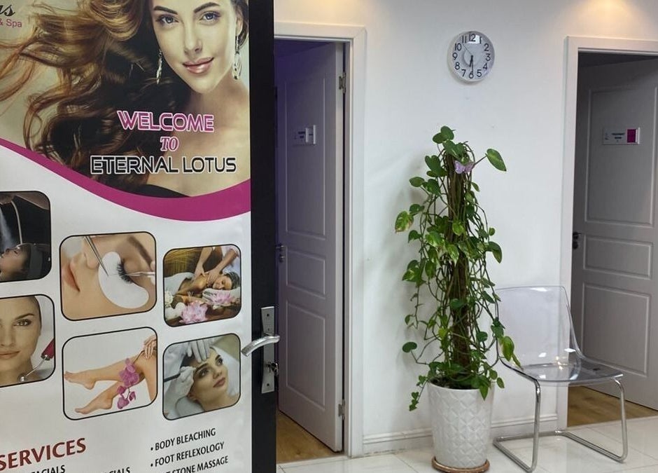 Entrance of Eternal Lotus Ladies Salon And Spa in دبي, دبي, AE with service menu and welcoming décor.