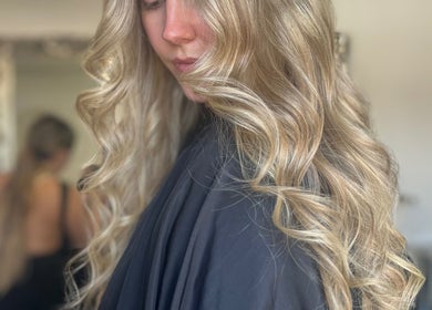 Blonde hair curled beautifully at Aurora House of Beauty, Eccles, England, GB for a stunning finish.