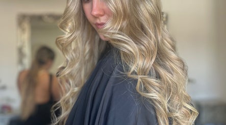 Blonde hair curled beautifully at Aurora House of Beauty, Eccles, England, GB for a stunning finish.