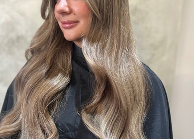 Beautiful long hair styled at Aurora House of Beauty, Eccles, England, GB highlighting expert salon services.