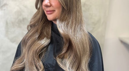 Beautiful long hair styled at Aurora House of Beauty, Eccles, England, GB highlighting expert salon services.