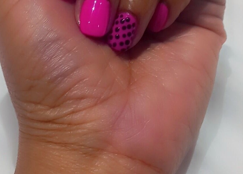 Stylish pink manicure with polka dots at Glamlash Lash studio, Johannesburg, Gauteng, ZA.