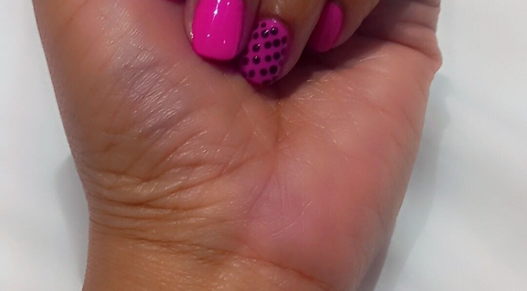 Stylish pink manicure with polka dots at Glamlash Lash studio, Johannesburg, Gauteng, ZA.