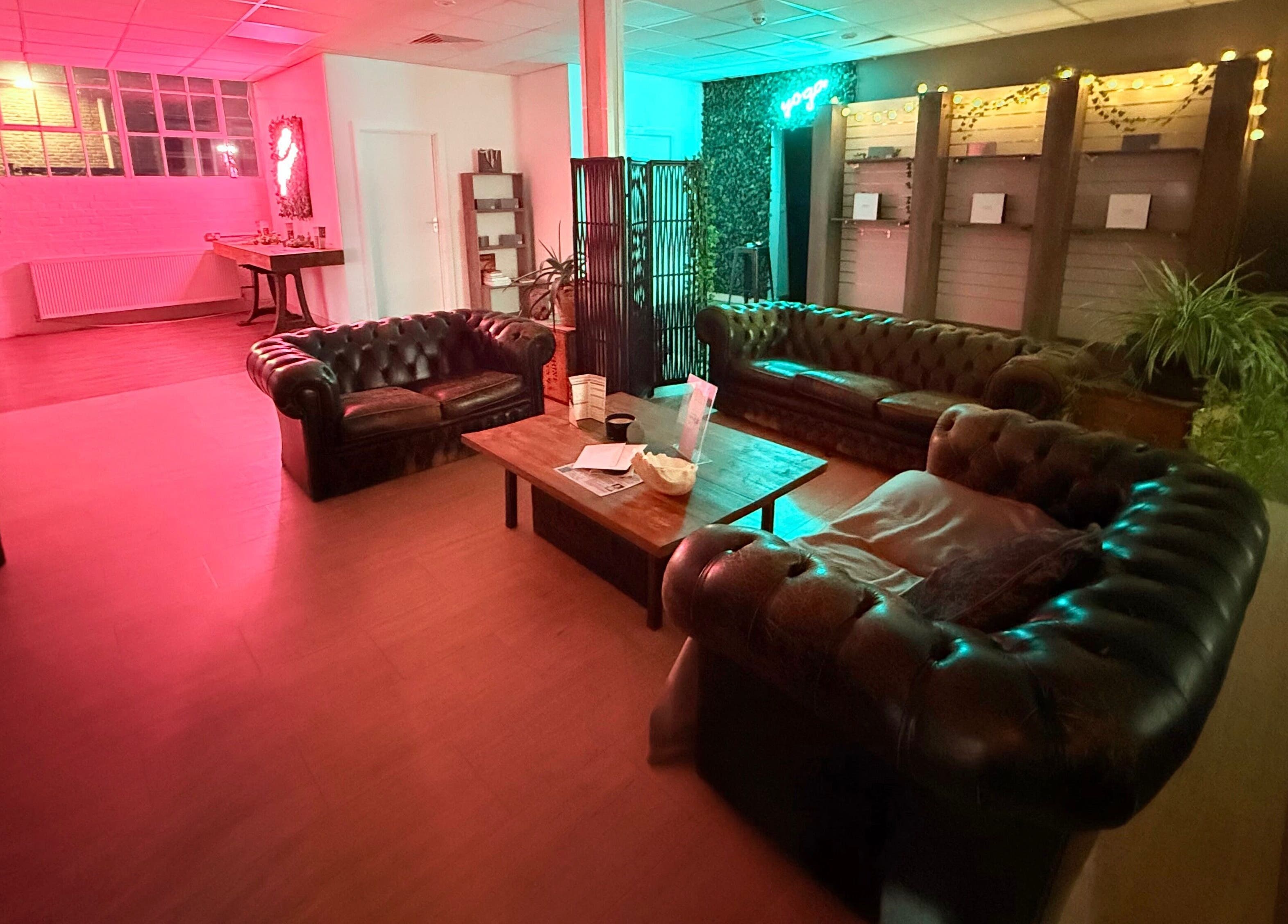 Cozy lounge area with elegant sofas at at1.AESTHETICS, Nottingham, England, GB.