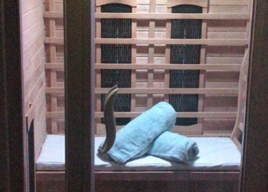 Relaxing sauna interior with towels at Time to Float, Calf Heath, England, GB.