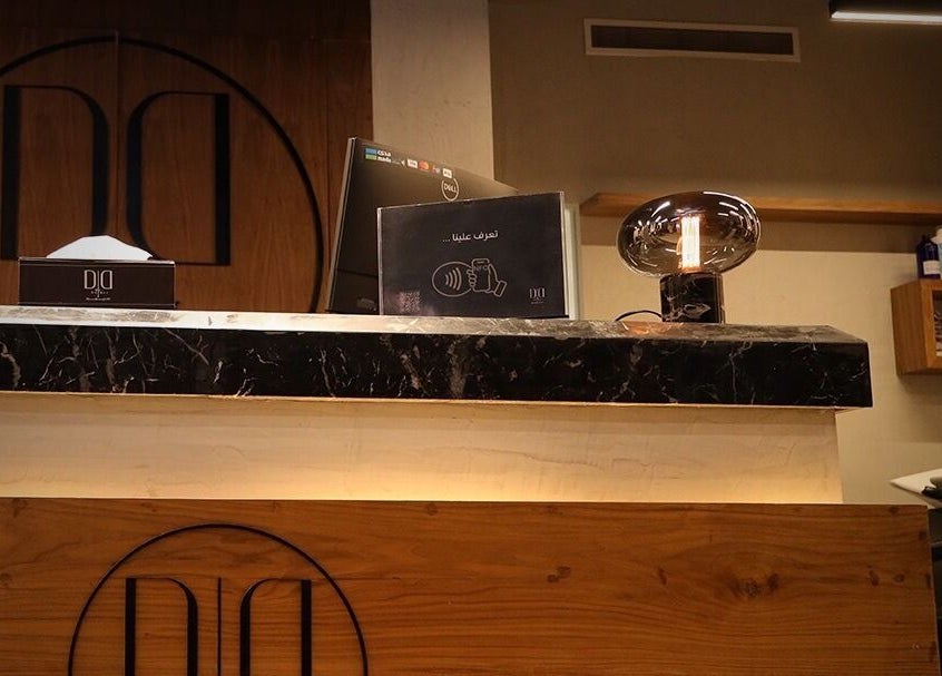 Reception area at Dar Dujour Men, الرياض, منطقة الرياض, SA, showcasing a stylish counter and decor.