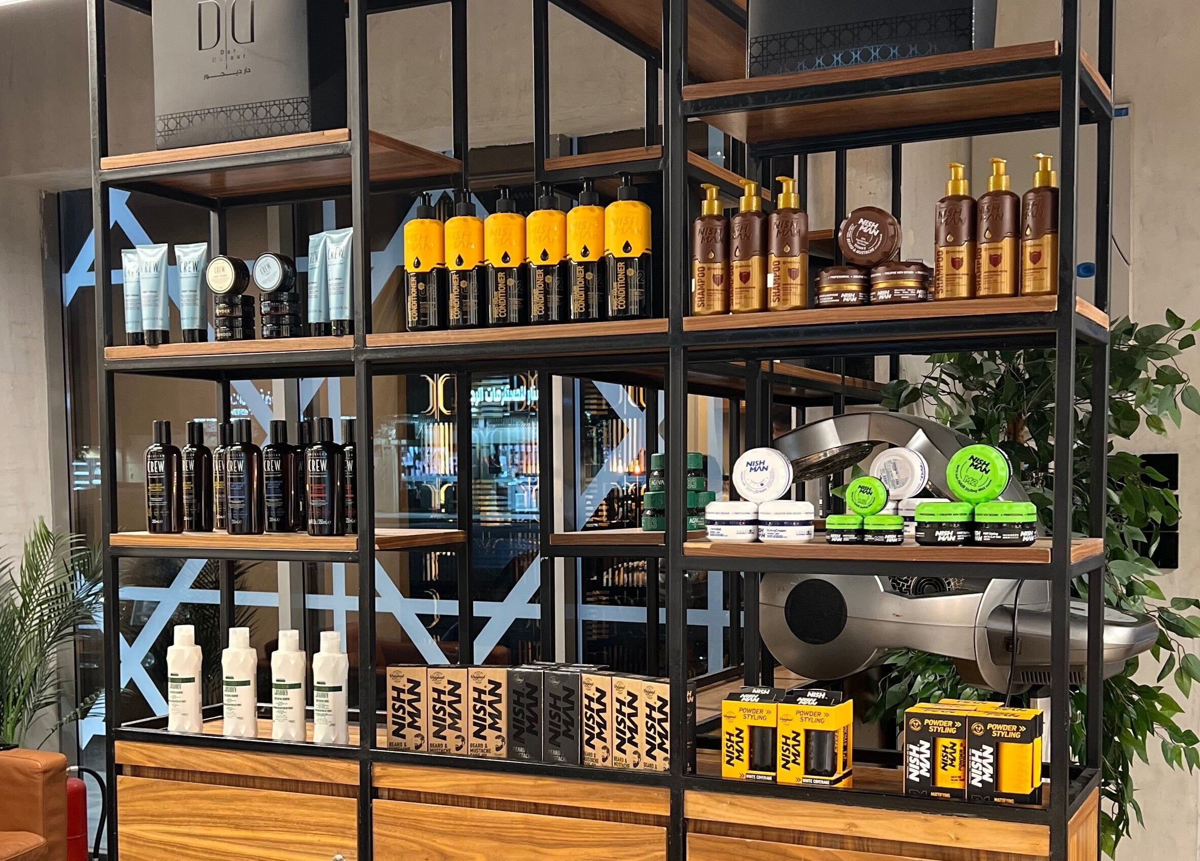 Shelves of beauty products at Dar Dujour Men, الرياض, منطقة الرياض, SA, showcasing diverse grooming options.
