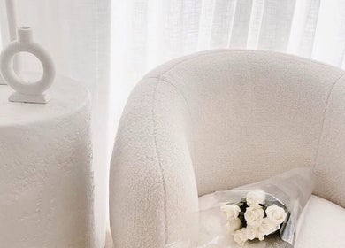 Elegant white chair with roses at The Wellness Atelier, Coolangatta, Queensland, AU.