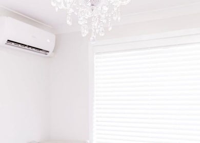 Chic chandelier and air conditioner in a serene room at The Wellness Atelier, Coolangatta, Queensland, AU.