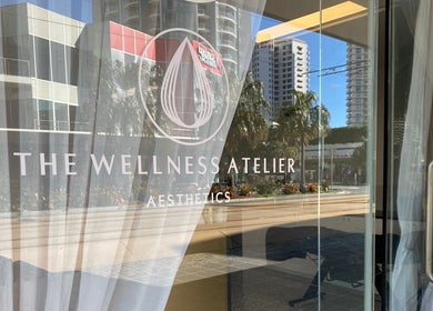 Entrance of The Wellness Atelier in Tweed Heads, New South Wales, AU showcasing sleek glass doors.