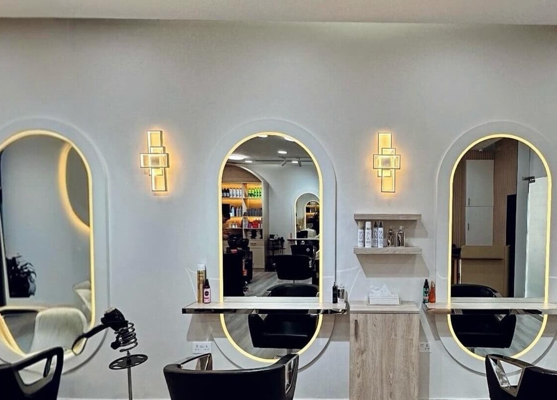 Stylish interior of Lili's House Beauty Salon in Dubai, Dubai, AE with illuminated mirrors and seating.