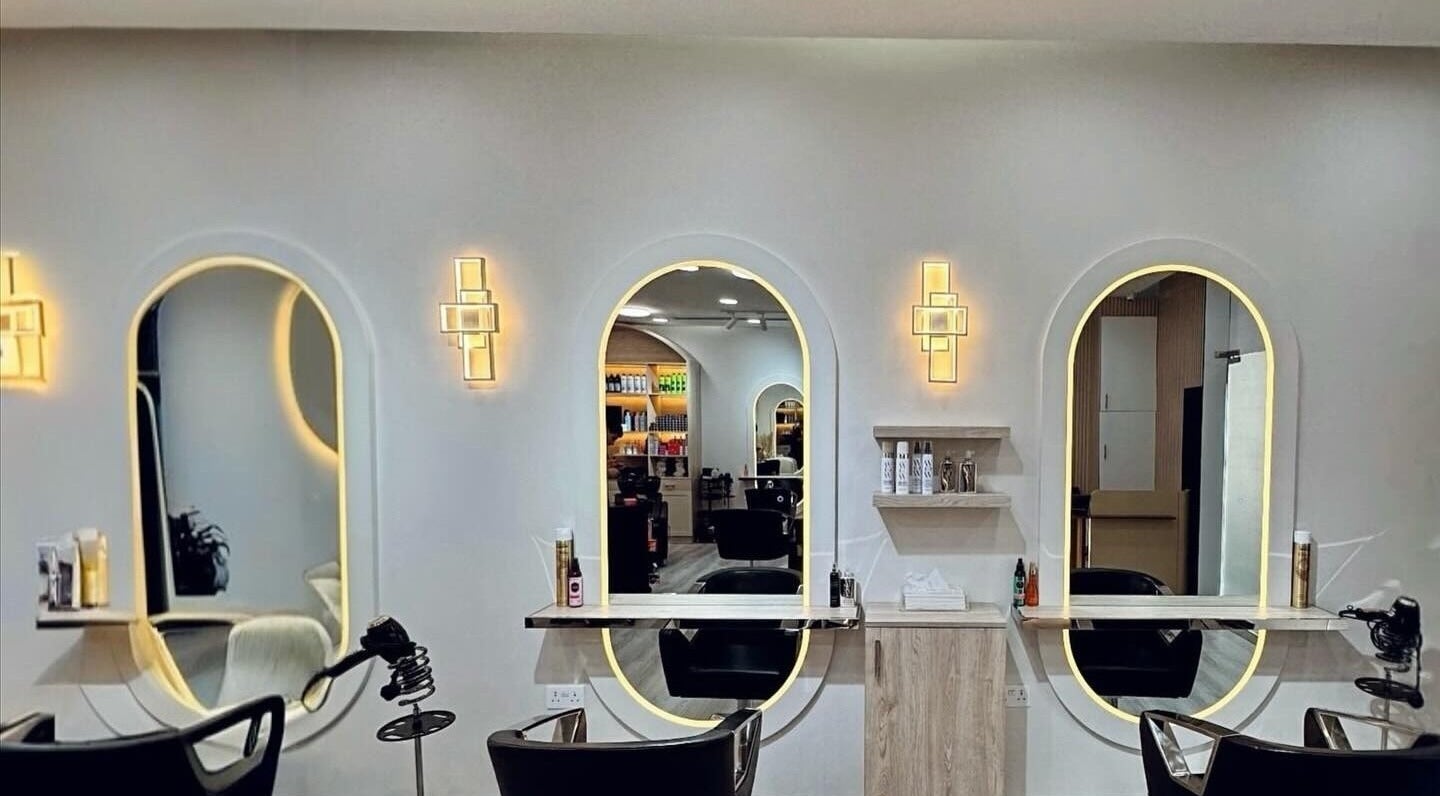 Stylish interior of Lili's House Beauty Salon in Dubai, Dubai, AE with illuminated mirrors and seating.