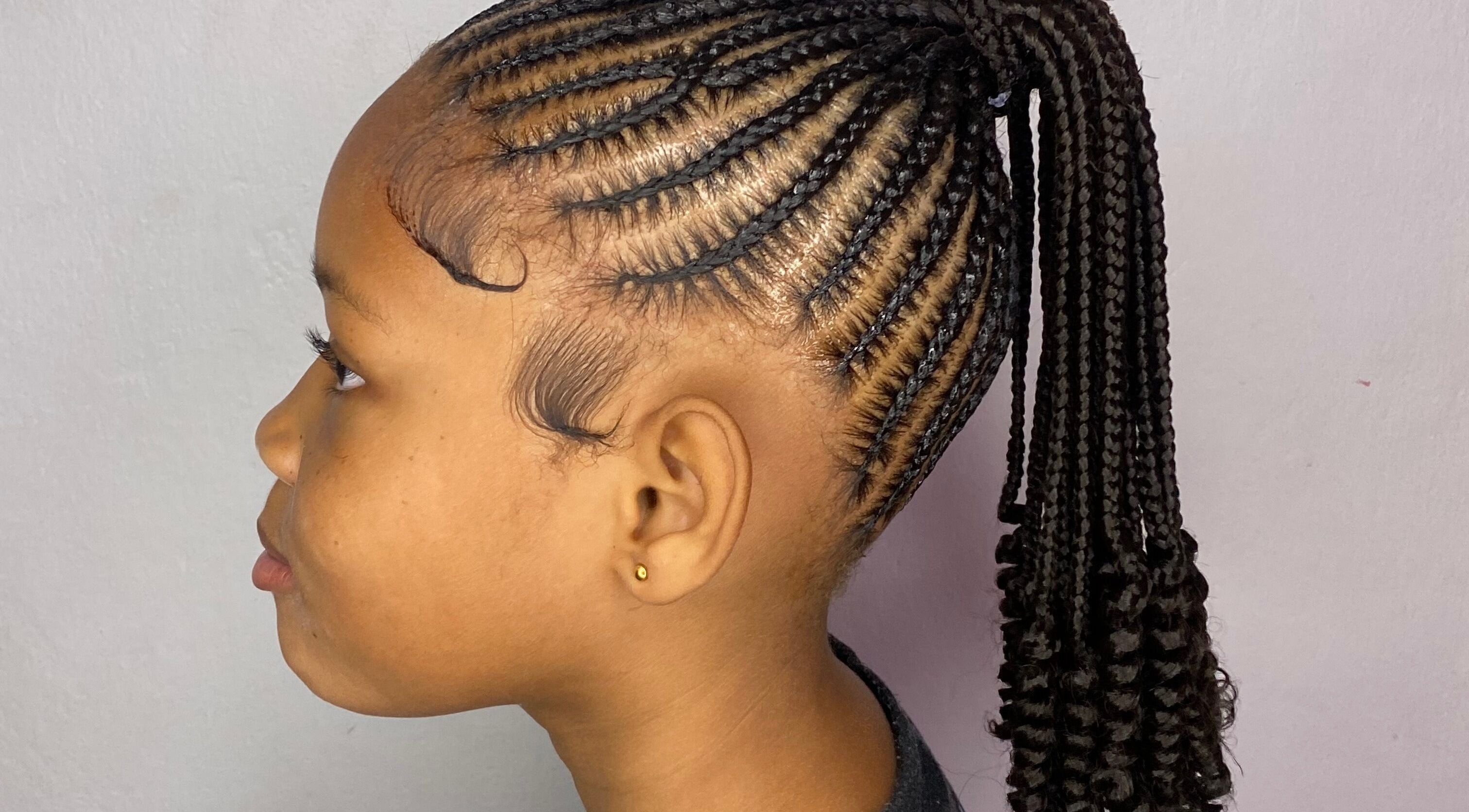 Stylish braided hairstyle at Mona's Beauty Spot, Bridgetown, Saint Philip, BB.