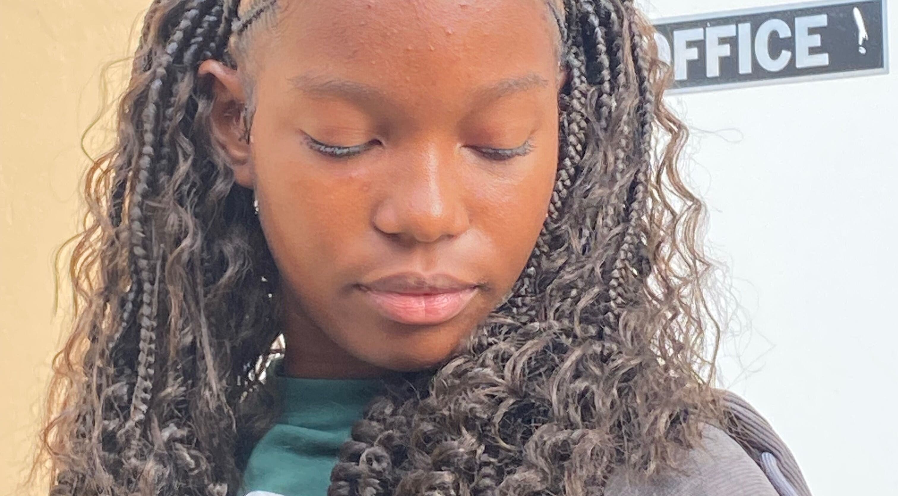 Elegant braided hairstyle at Mona's Beauty Spot, Bridgetown, Saint Philip, BB.