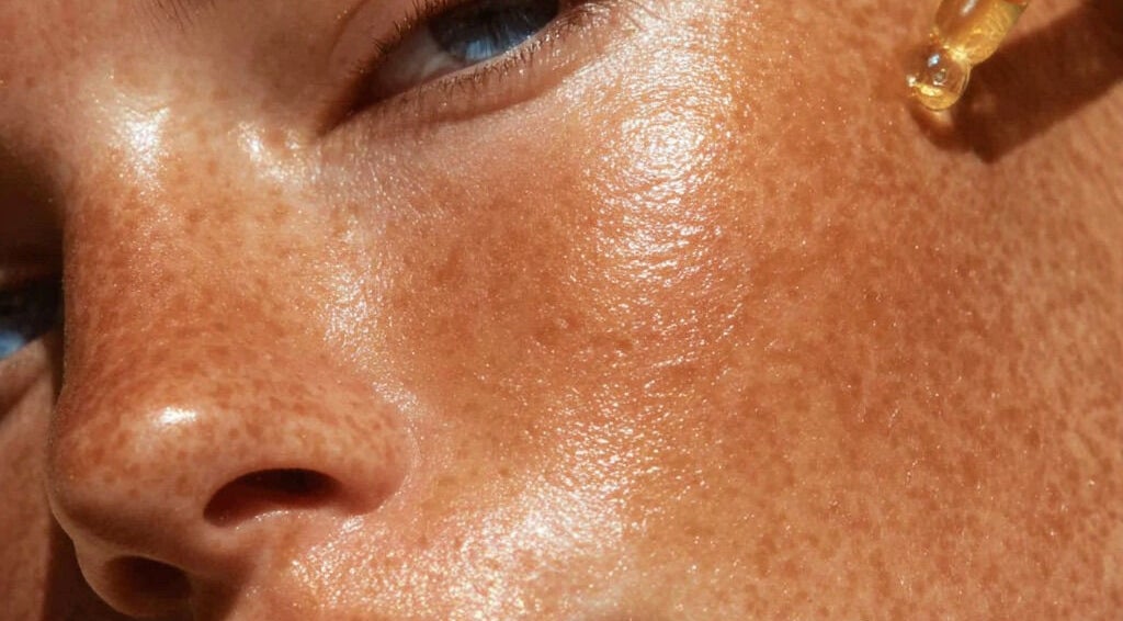 Close-up of radiant skin with serum applied at Lucia Skincare, Newbury, England, GB.