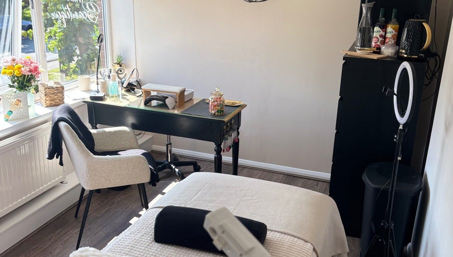 Cozy beauty treatment room at The Beautique in Atherstone, England, GB with elegant decor and natural light.