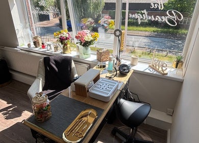 Bright and inviting beauty workspace at The Beautique, Atherstone, England, GB, featuring flowers and decor.