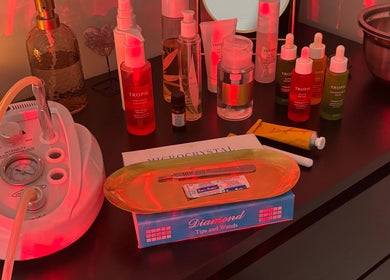 Beauty treatment setup at The Beautique, Atherstone, England, GB with skincare and microdermabrasion tools.