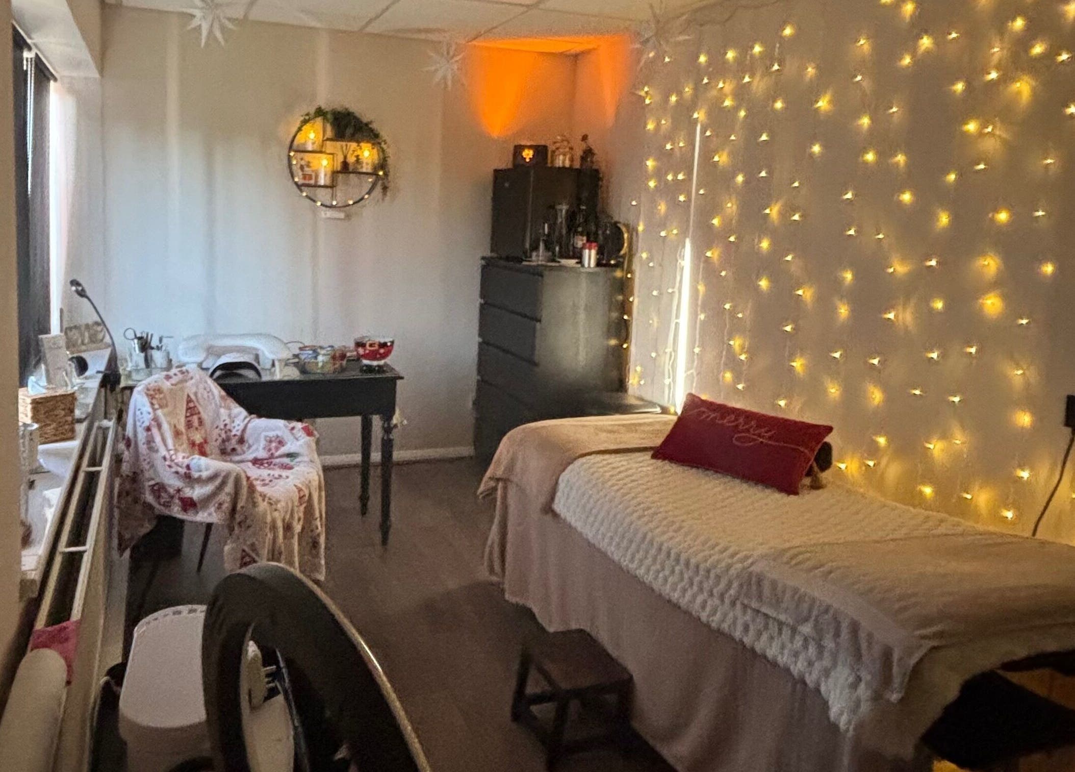 Serene treatment room with warm lights at The Beautique, Atherstone, England, GB.