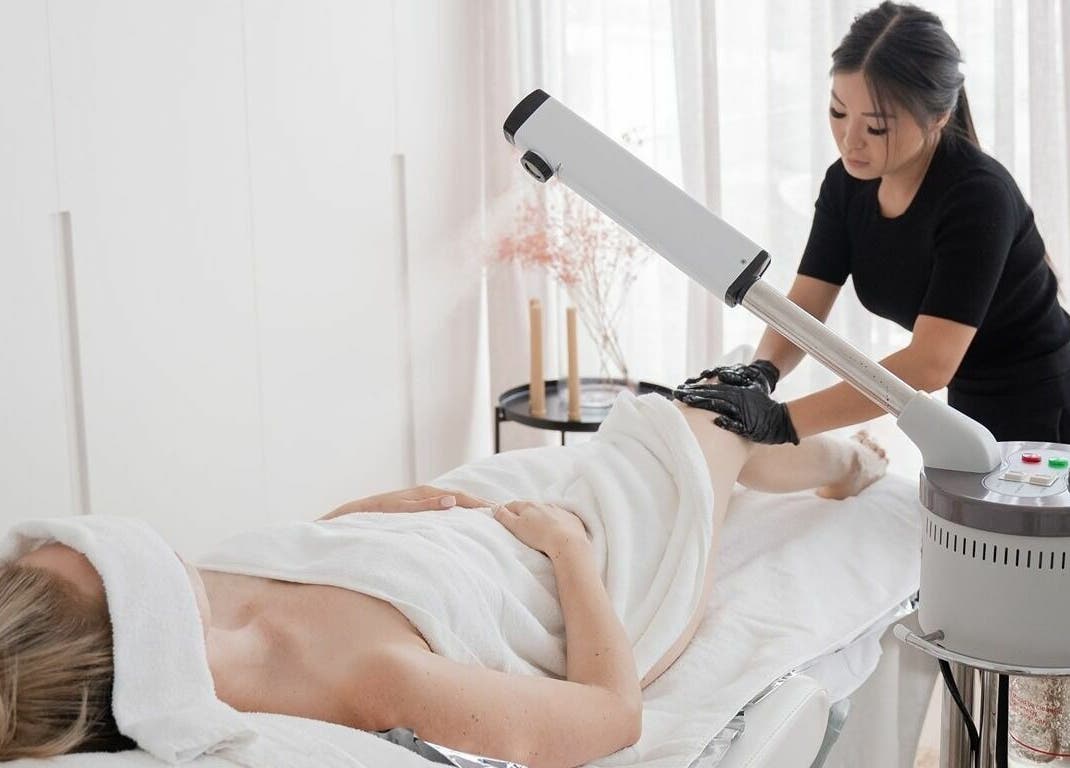 Therapist performing spa treatment at By Stella, Cronulla, New South Wales, AU. Serene and professional ambiance.