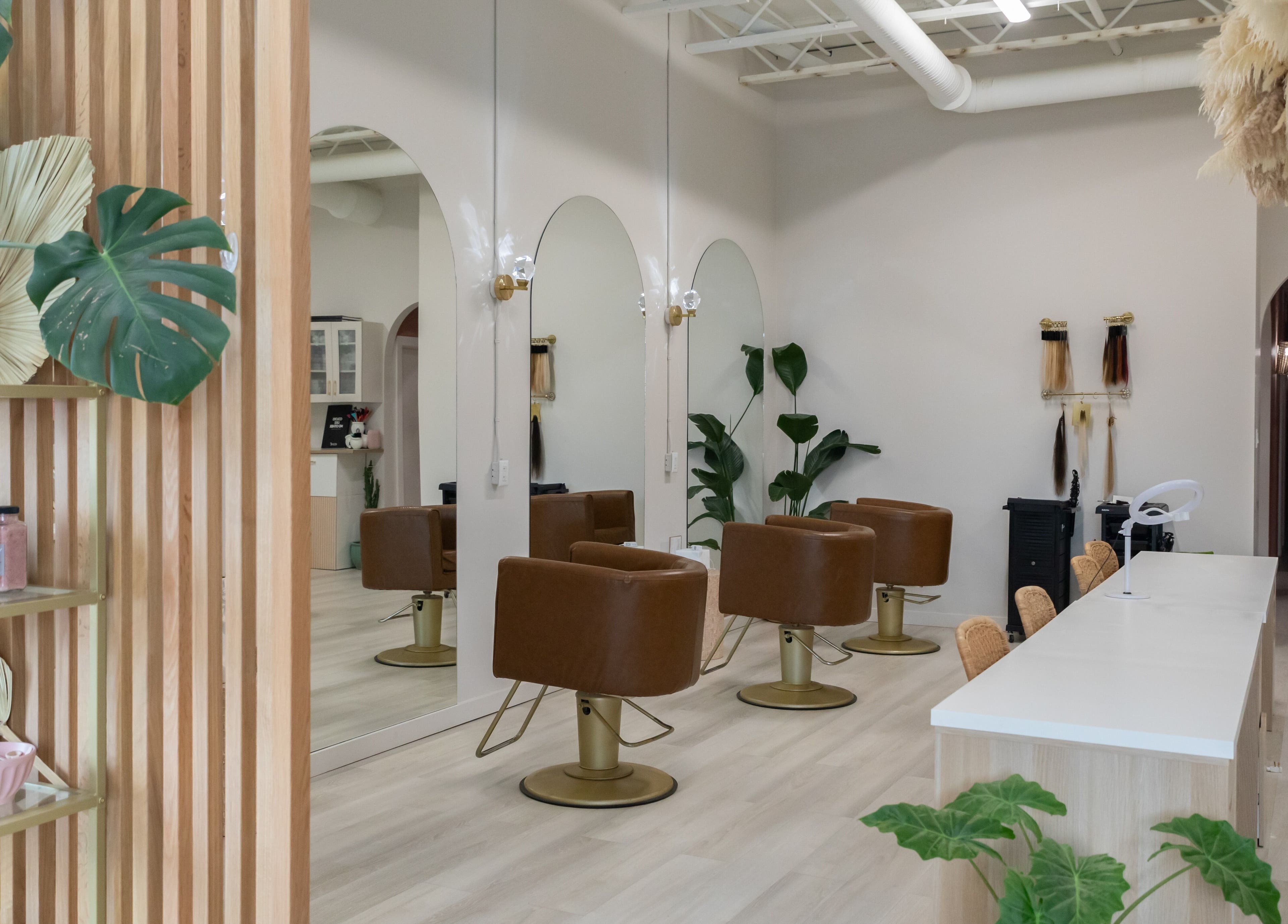 Elegant salon chairs and decor at Salt Day Spa, Leduc, Alberta, CA, showcasing modern wellness ambiance.