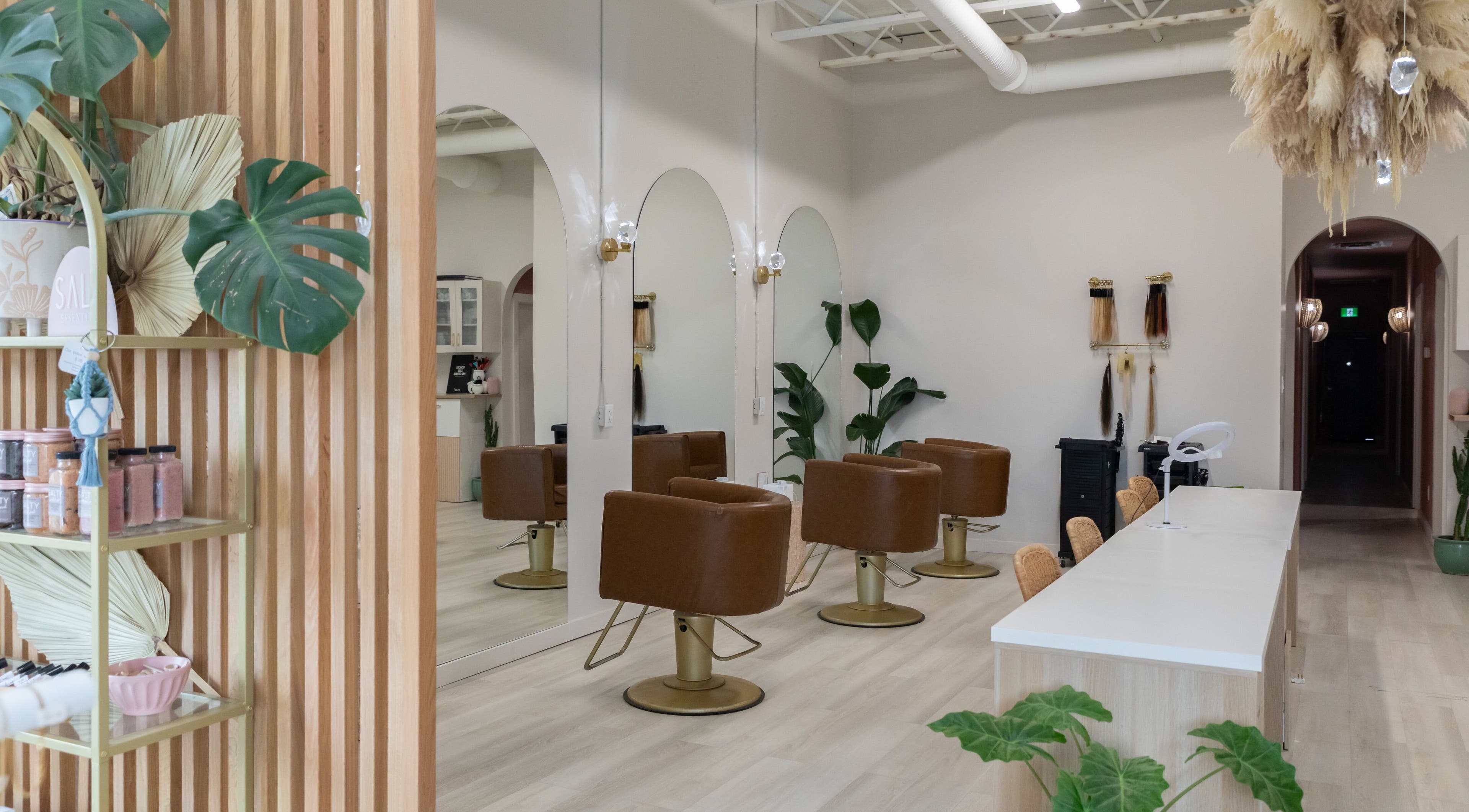 Elegant salon chairs and decor at Salt Day Spa, Leduc, Alberta, CA, showcasing modern wellness ambiance.