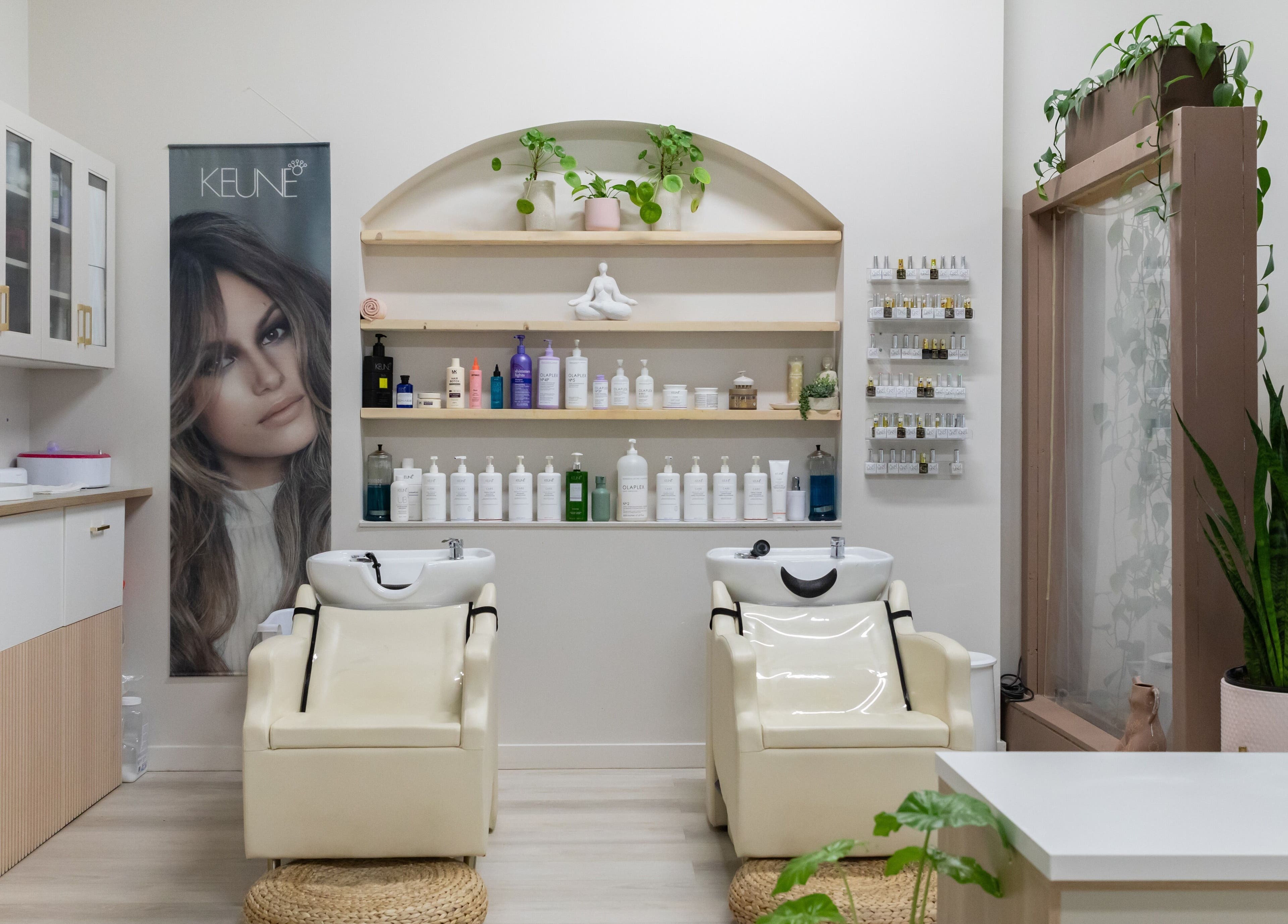 Salt Day Spa in Leduc, Alberta, CA features a welcoming hair wash area with modern chairs and organic products.