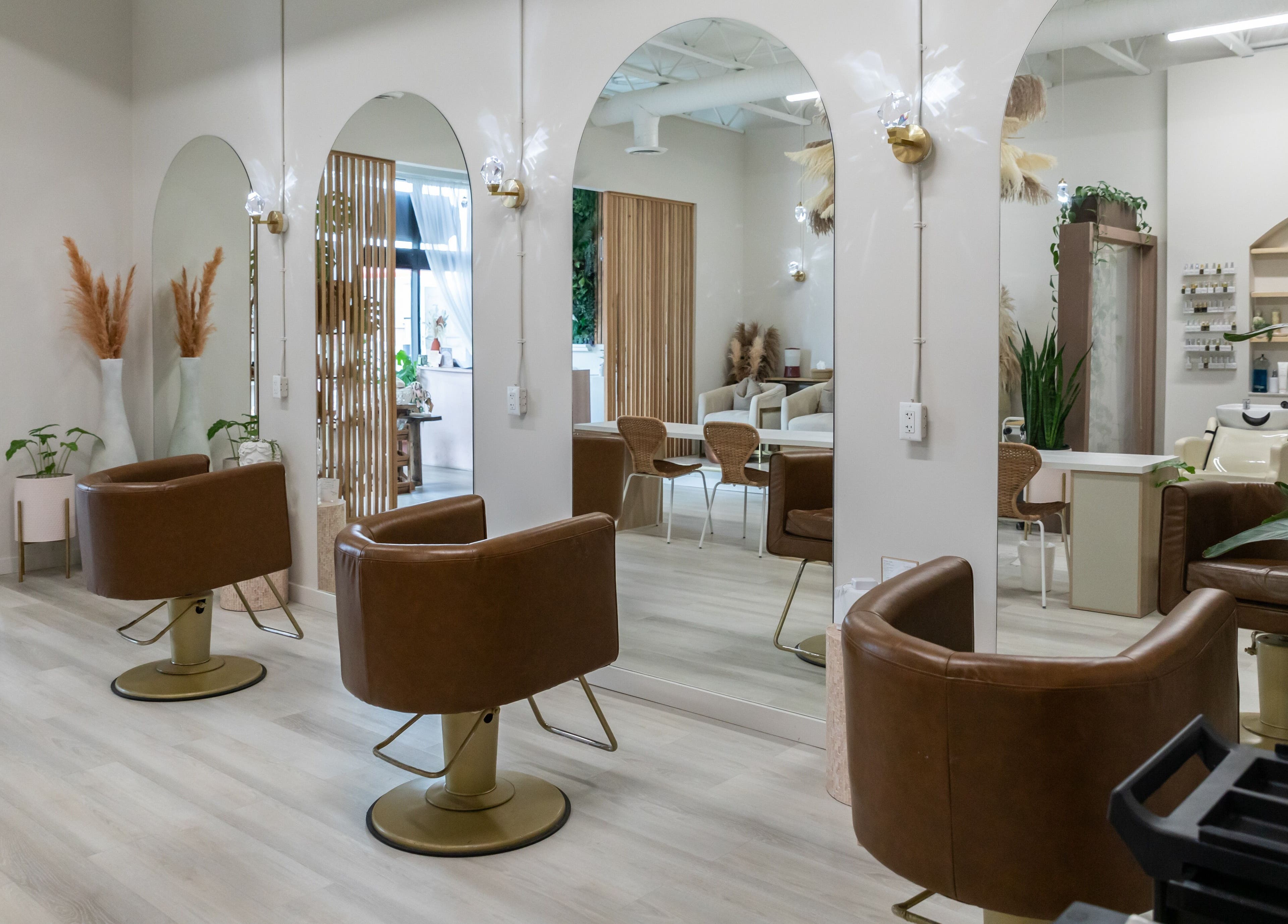 Modern salon interior with stylish chairs and decor at Salt Day Spa, Leduc, Alberta, CA.