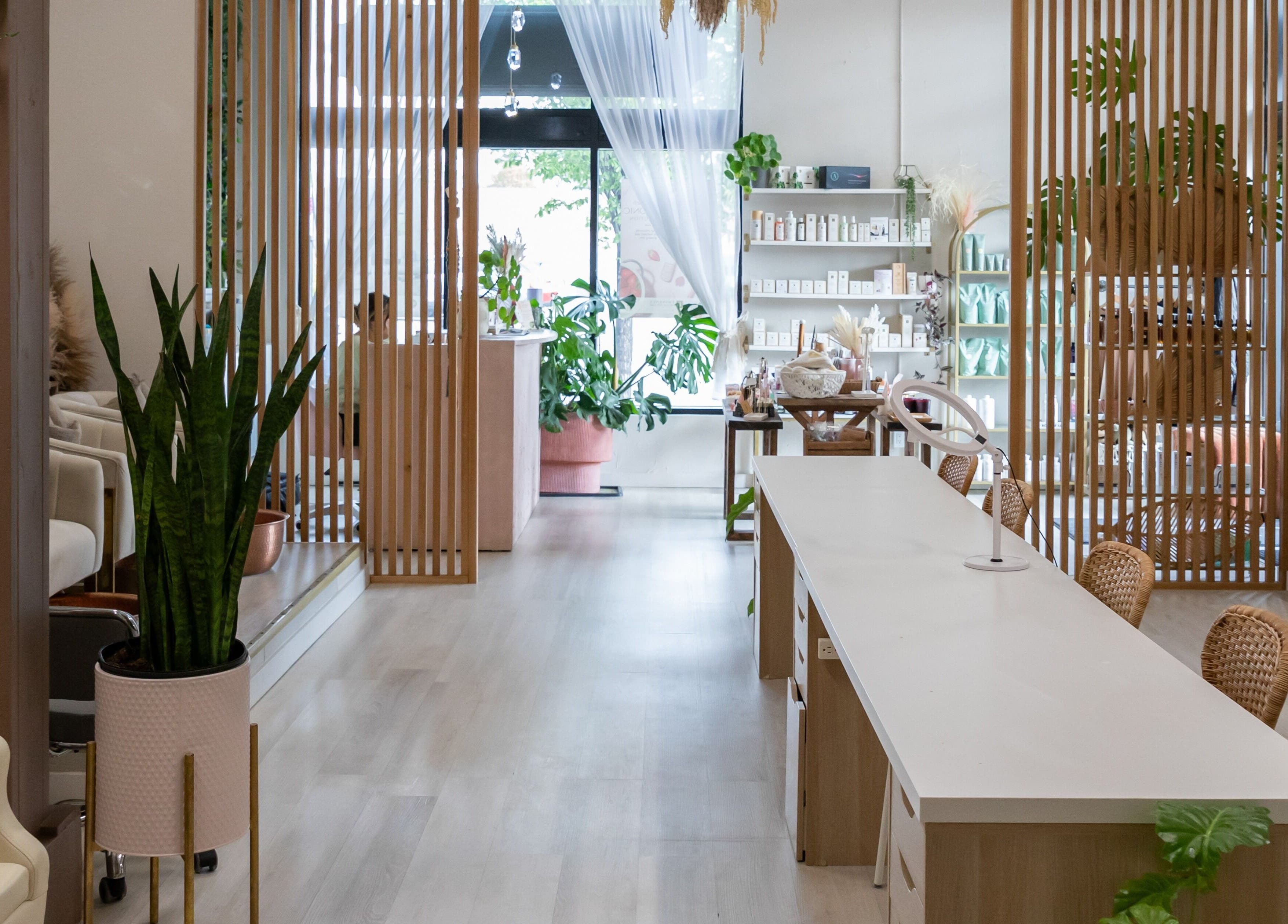 Inviting interior of Salt Day Spa in Leduc, Alberta, CA with modern decor and lush green plants.