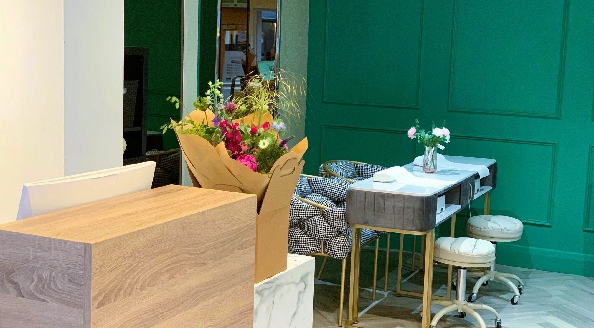 Elegant Nails & Brows salon interior in Dublin, County Dublin, IE featuring sleek furniture and floral decor.