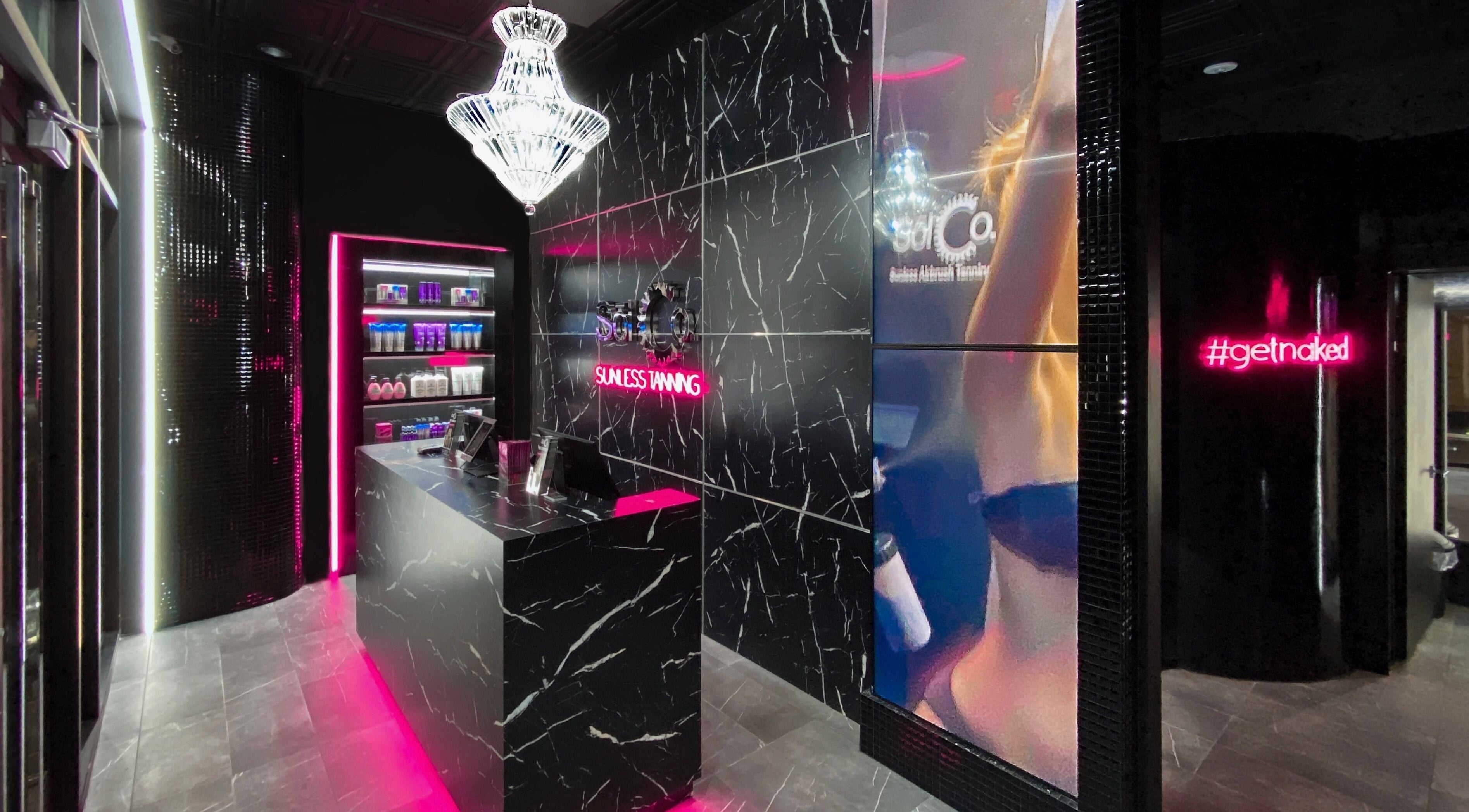 Elegantly lit lobby of Sol Sunless Tanning - McKinney, showcasing sleek modern design in McKinney, Texas, US.