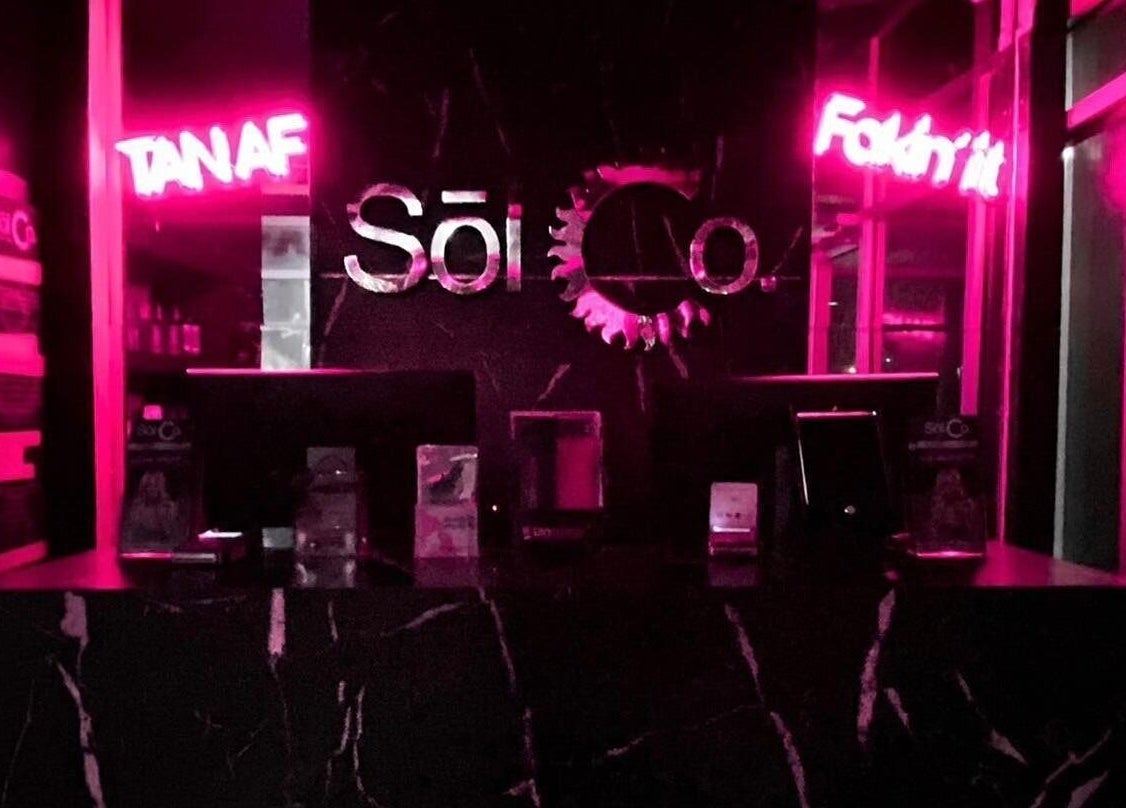 Neon-lit interior of Sol Sunless Tanning - Dallas Mockingbird in Dallas, Texas, US.