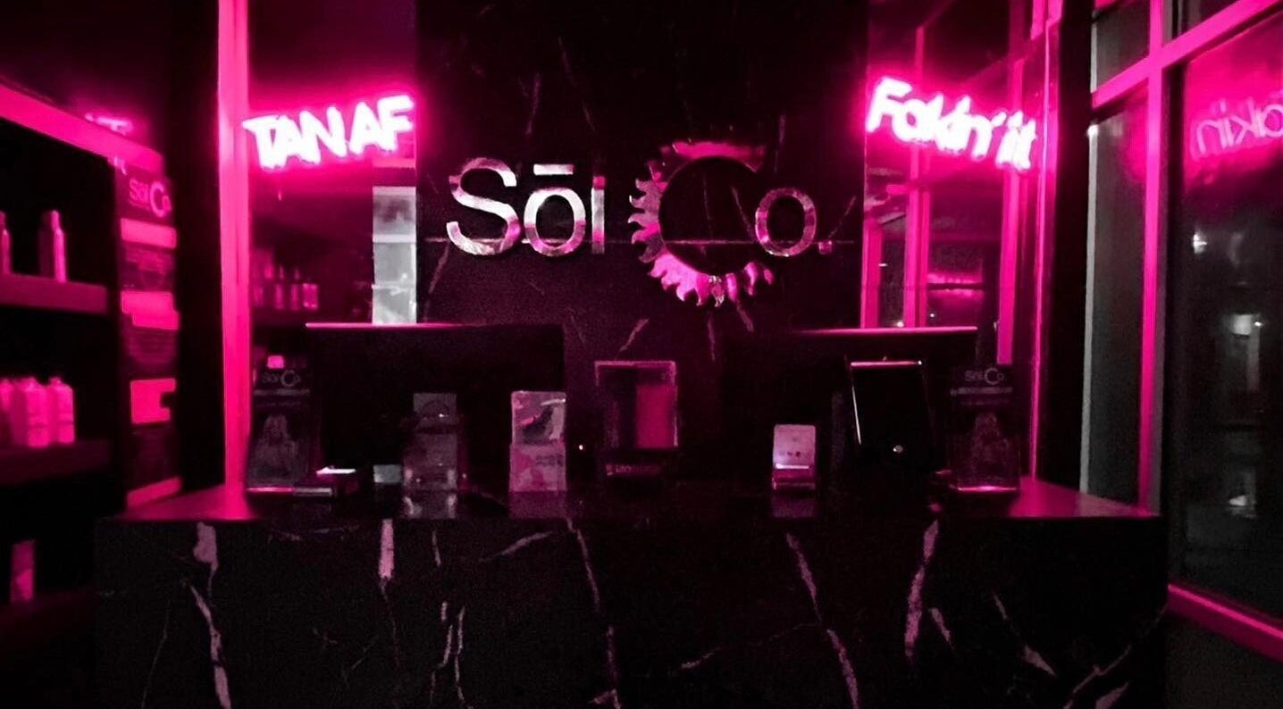 Neon-lit interior of Sol Sunless Tanning - Dallas Mockingbird in Dallas, Texas, US.