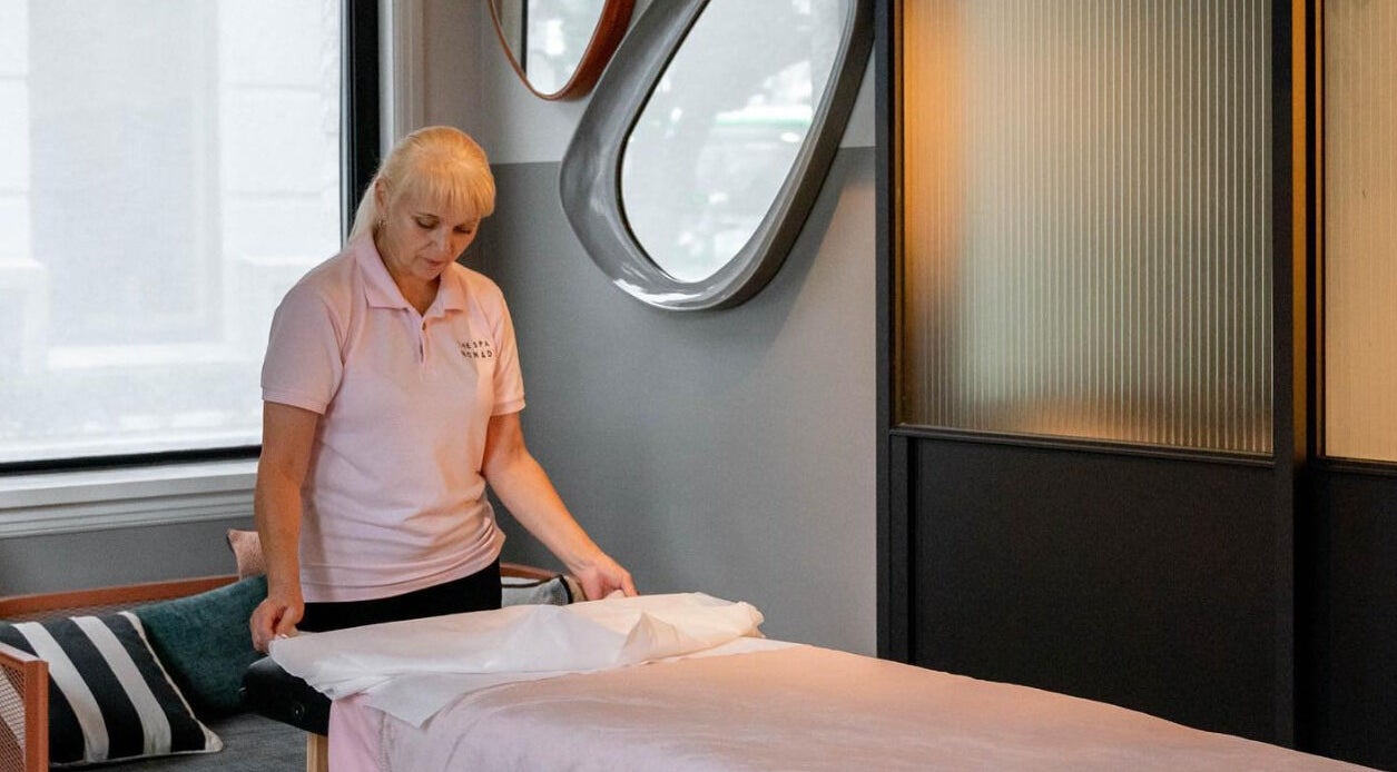 The Spa Nomad professional prepares a massage table in Auckland, Auckland, NZ mobile business.
