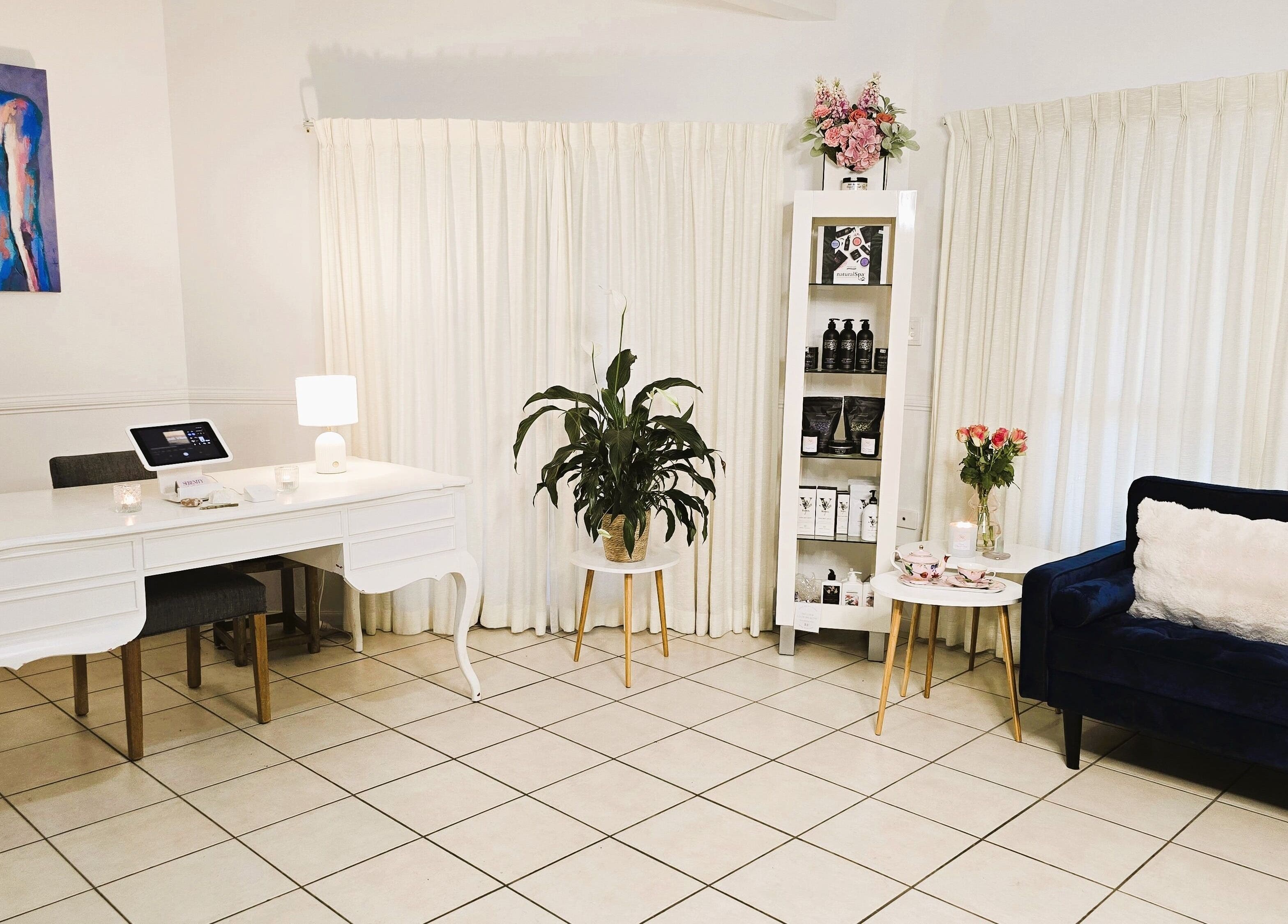 Serenity Glow Skin Rituals & Wellness reception in Morningside, Queensland, AU with elegant decor and cozy seating.