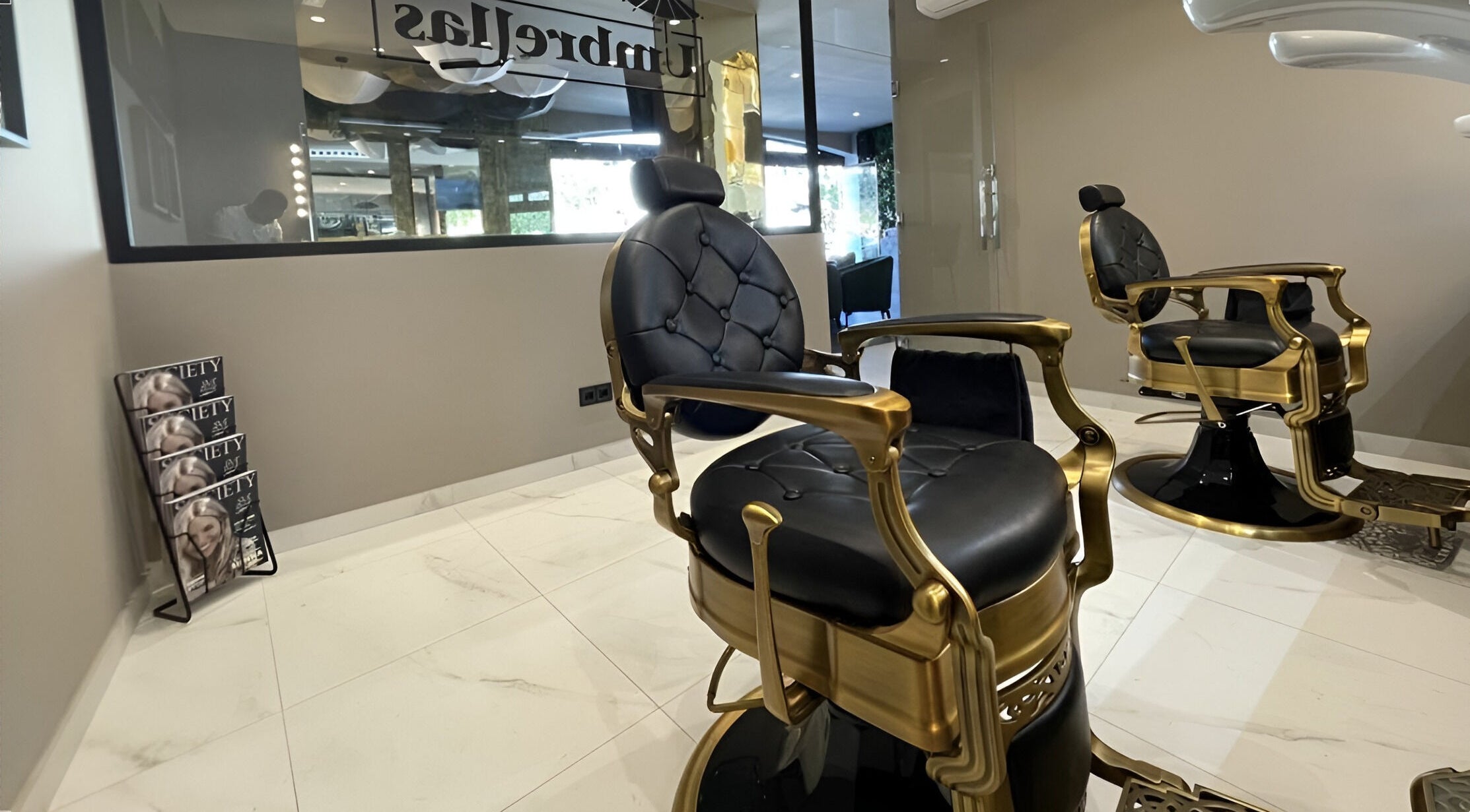 Elegant salon chairs at Mark Malota, Marbella, Andalucía, ES, showcasing premium comfort and style.
