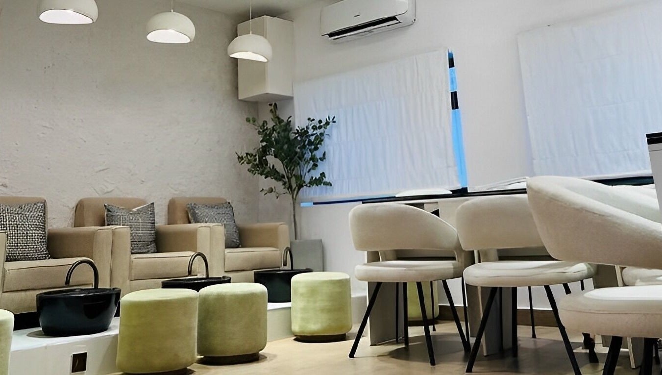 Chic seating area in The Triplets Studio, Lagos, Lagos, NG with modern decor and cozy chairs.