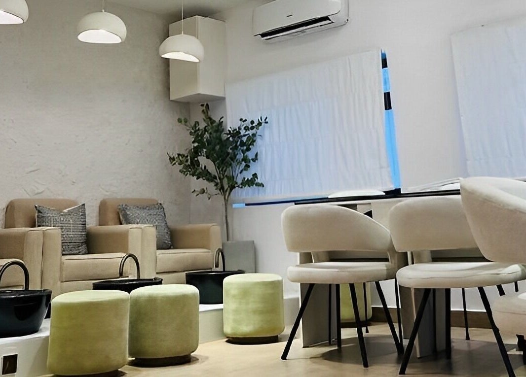 Chic seating area in The Triplets Studio, Lagos, Lagos, NG with modern decor and cozy chairs.