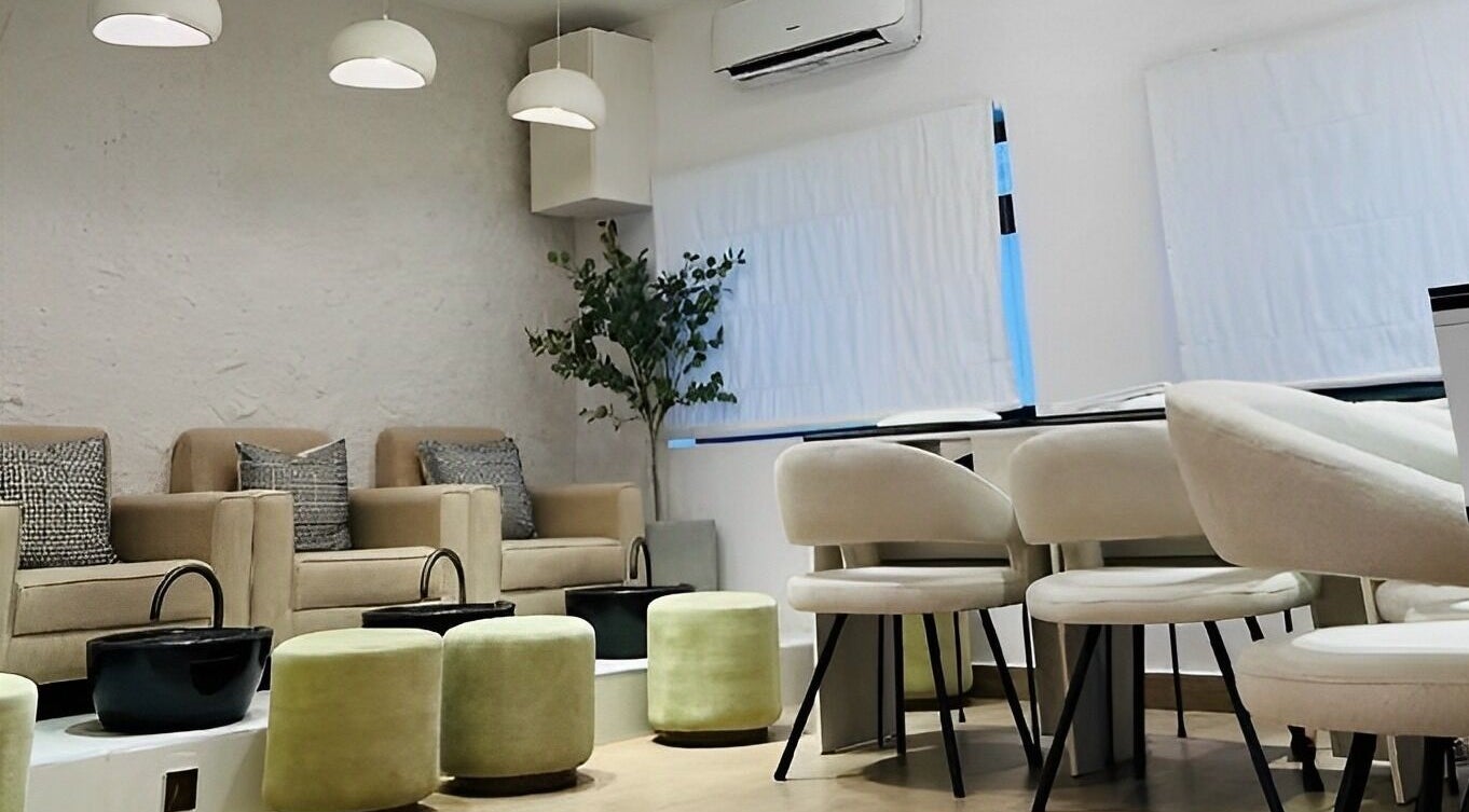 Chic seating area in The Triplets Studio, Lagos, Lagos, NG with modern decor and cozy chairs.