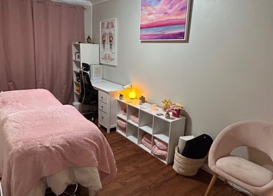 Cozy treatment room at Heaven In A Touch, Bertram, Western Australia, AU, featuring calming ambiance and pink tones.