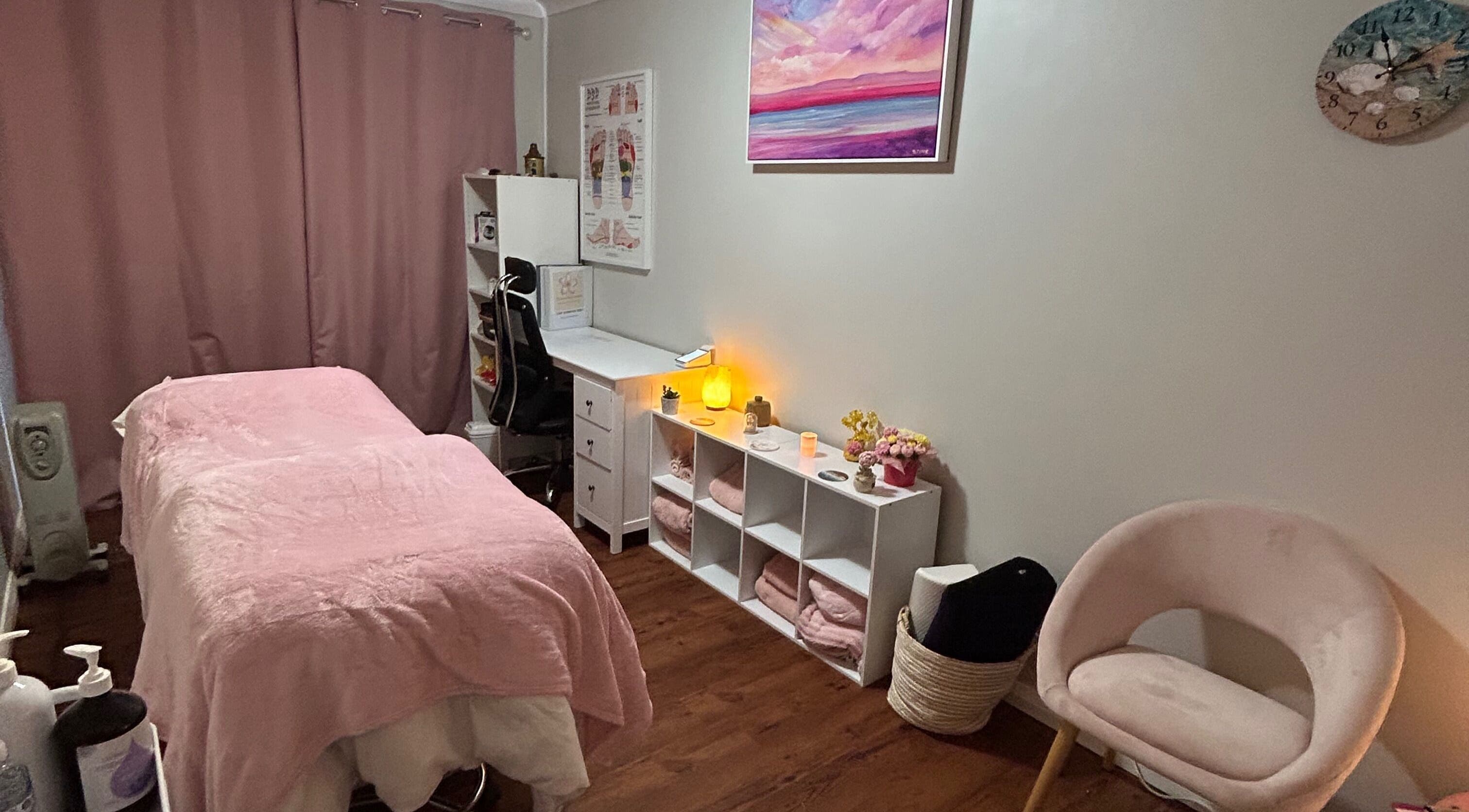 Cozy treatment room at Heaven In A Touch, Bertram, Western Australia, AU, featuring calming ambiance and pink tones.