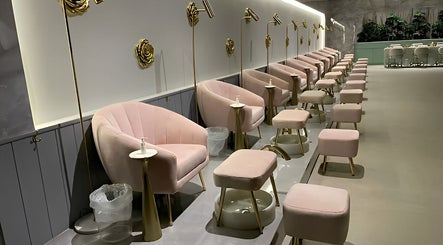 Luxurious pedicure area at Naila Spa - Alwurud, Riyadh, Riyadh Province, SA, showcasing plush pink chairs.